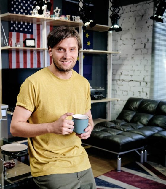 happy-man-with-cup-of-coffee-2021-09-24-03-44-58-utc-1-e1668145088523.jpg
